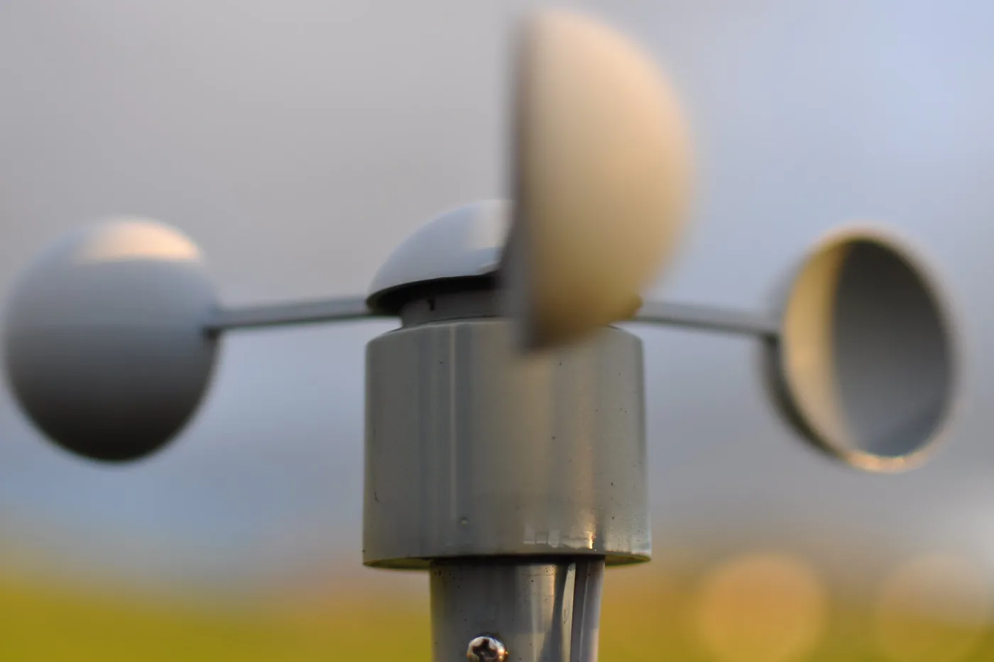 Close-up of a three-cup anemometer, the instrument that measures wind speed