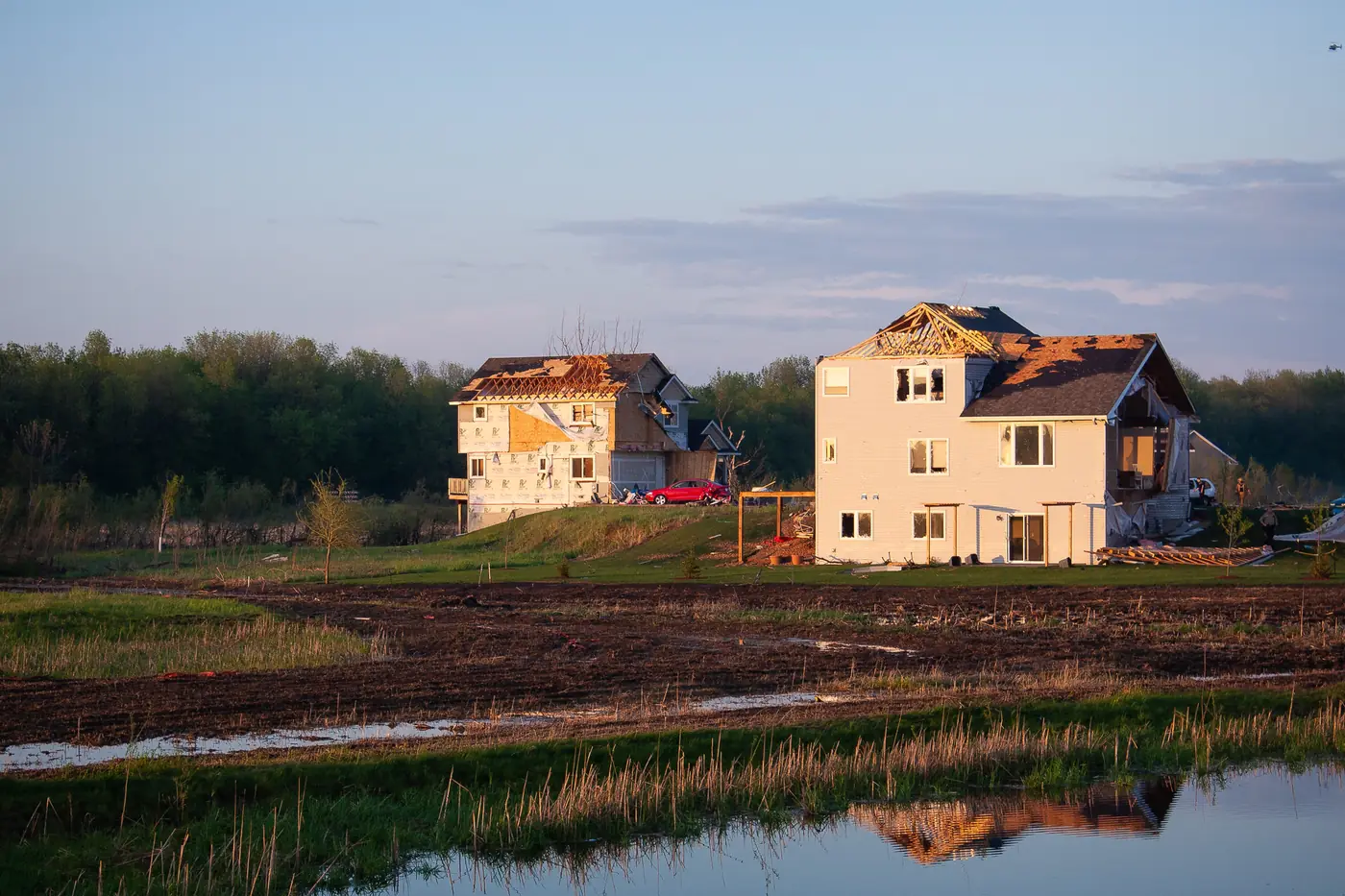 Homes with roof sections and siding torn away after the May 25, 2008 tornado in Hugo, Minnesota