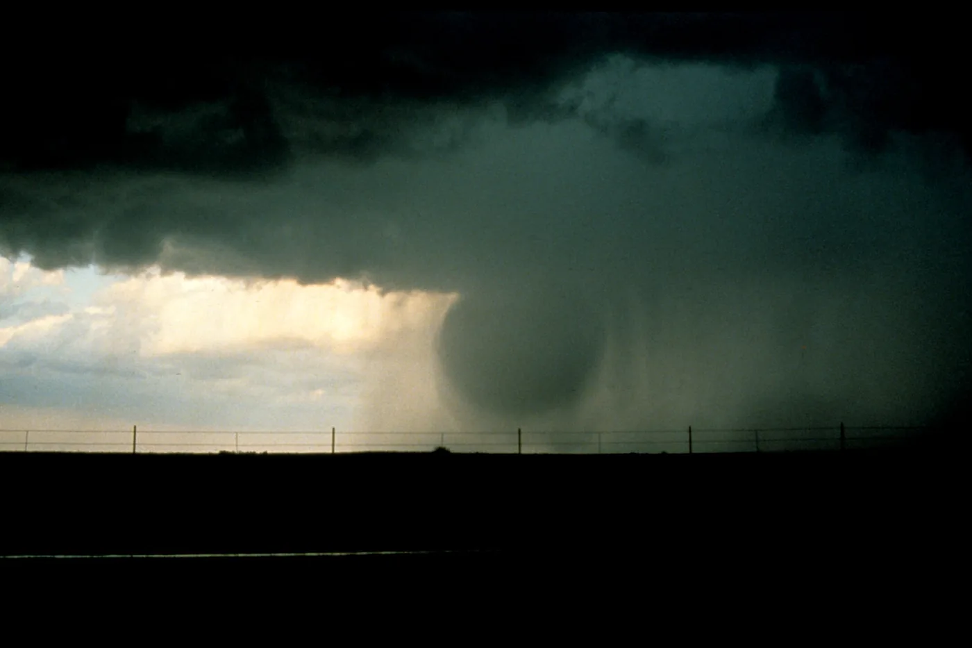 Wet microburst: a dense shaft of rain and wind plunging from a thunderstorm to the ground