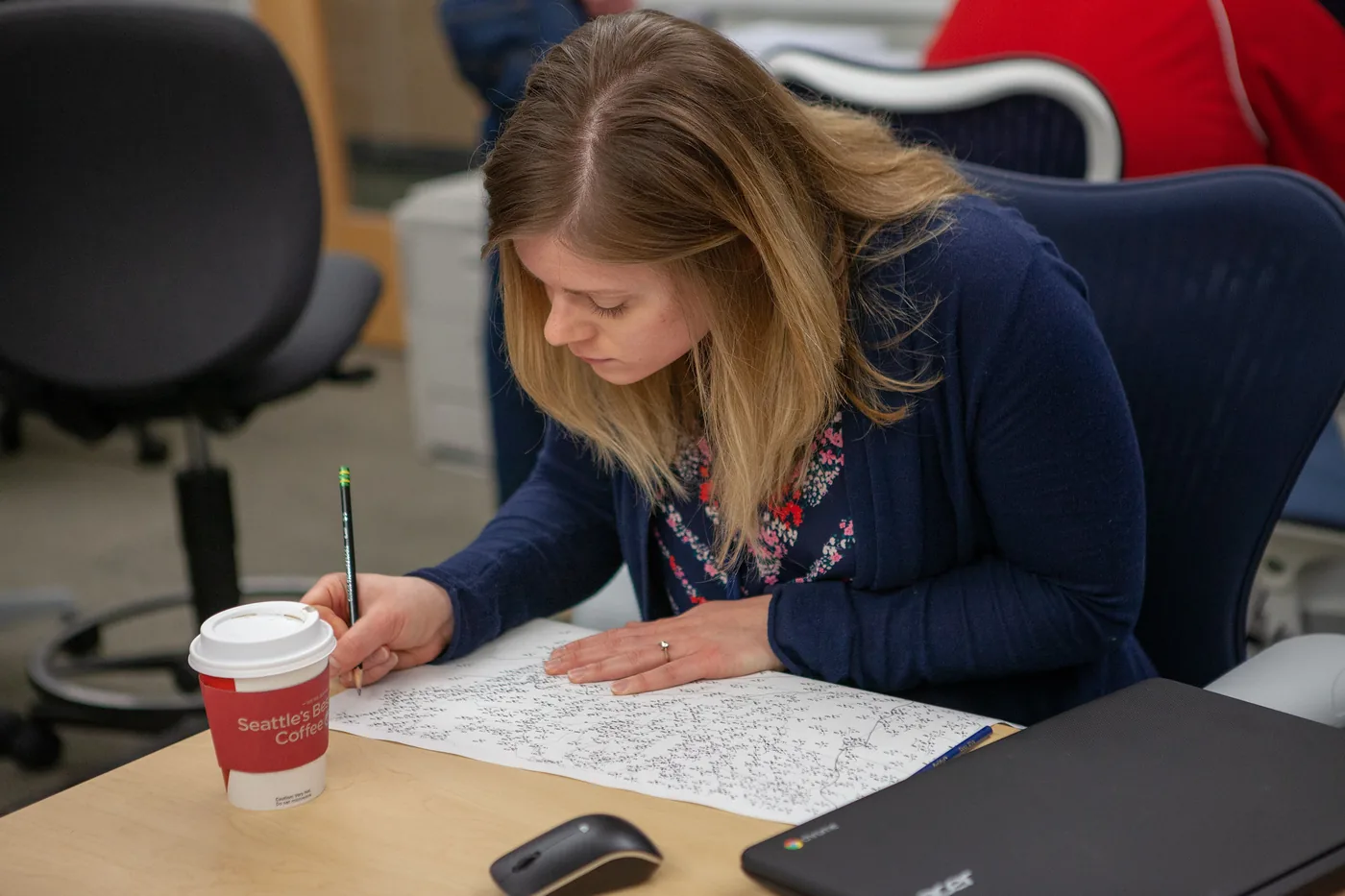 Forecaster hand-analyzing a printed weather map during a NOAA Hazardous Weather Testbed forecast experiment