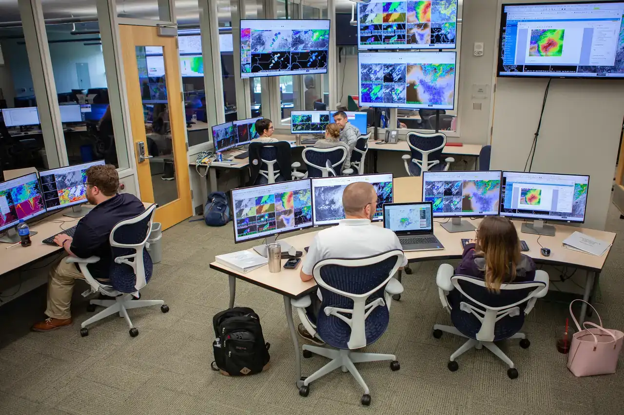 National Weather Service forecasters at radar and satellite workstations in NOAA's Hazardous Weather Testbed