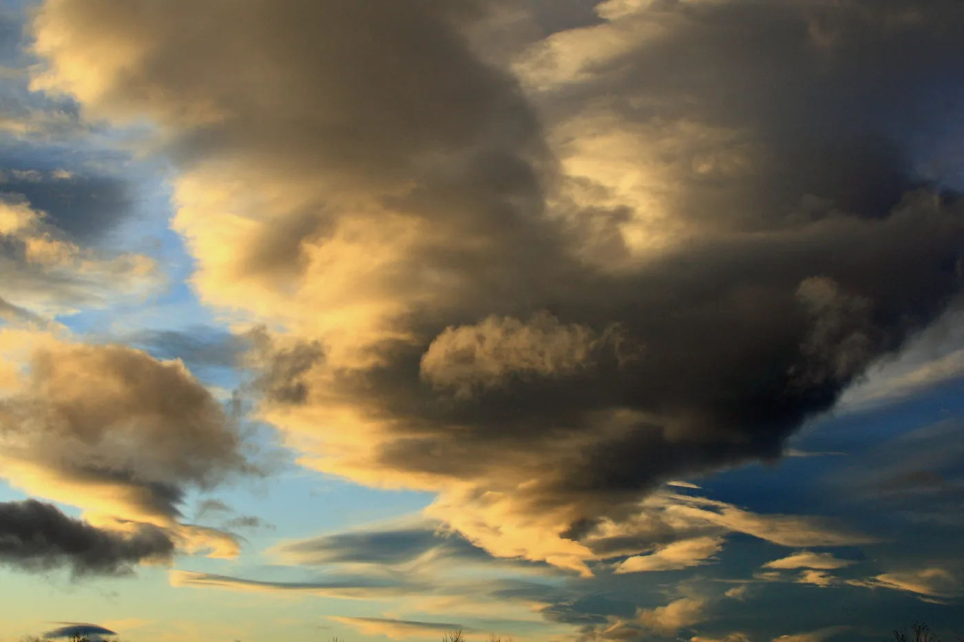 Dramatic swirling clouds lit by low sun over Anchorage, Alaska, in December