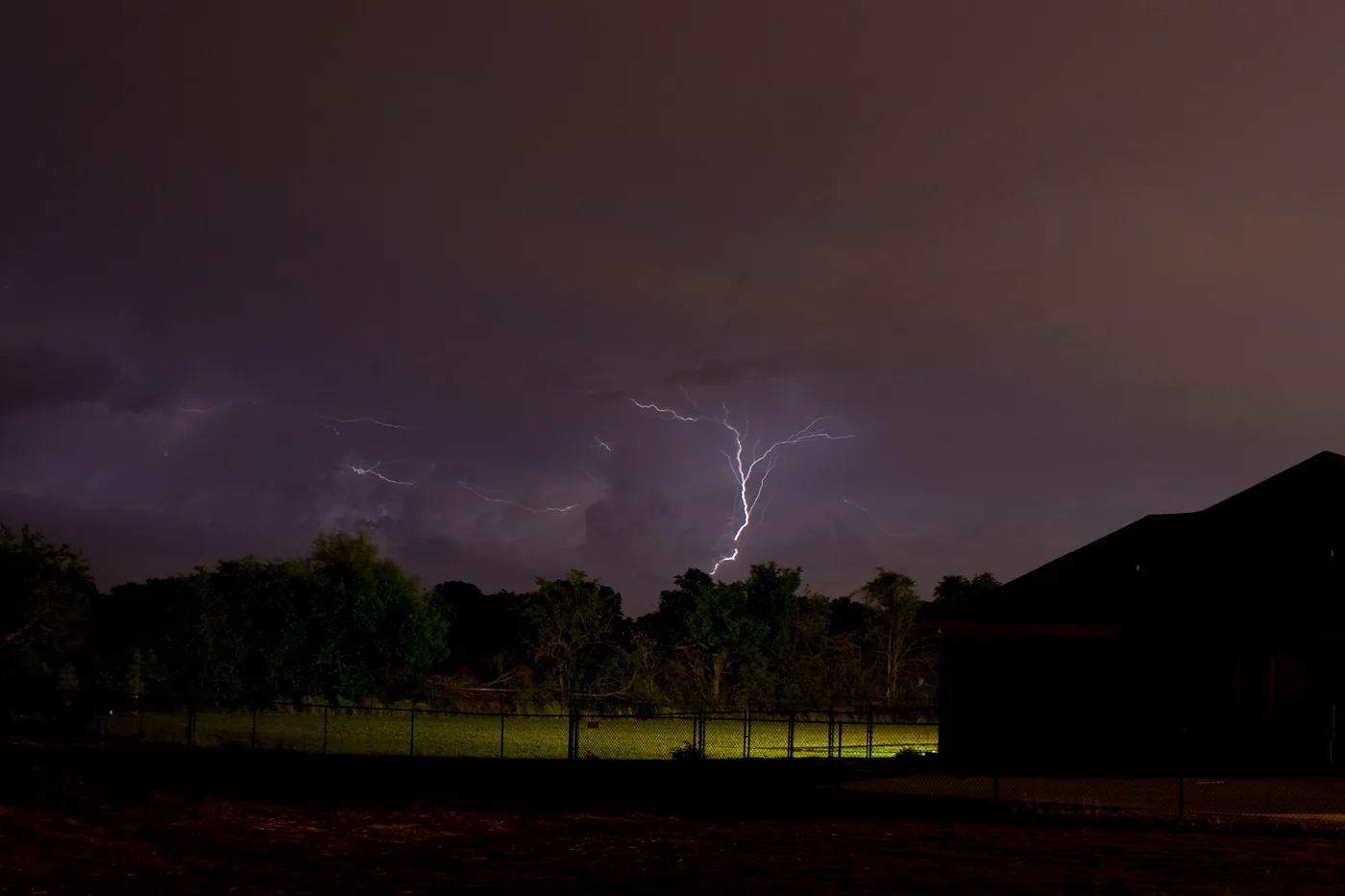 Lightning bolt in a night thunderstorm over a field in Meridianville, just north of Huntsville, Alabama