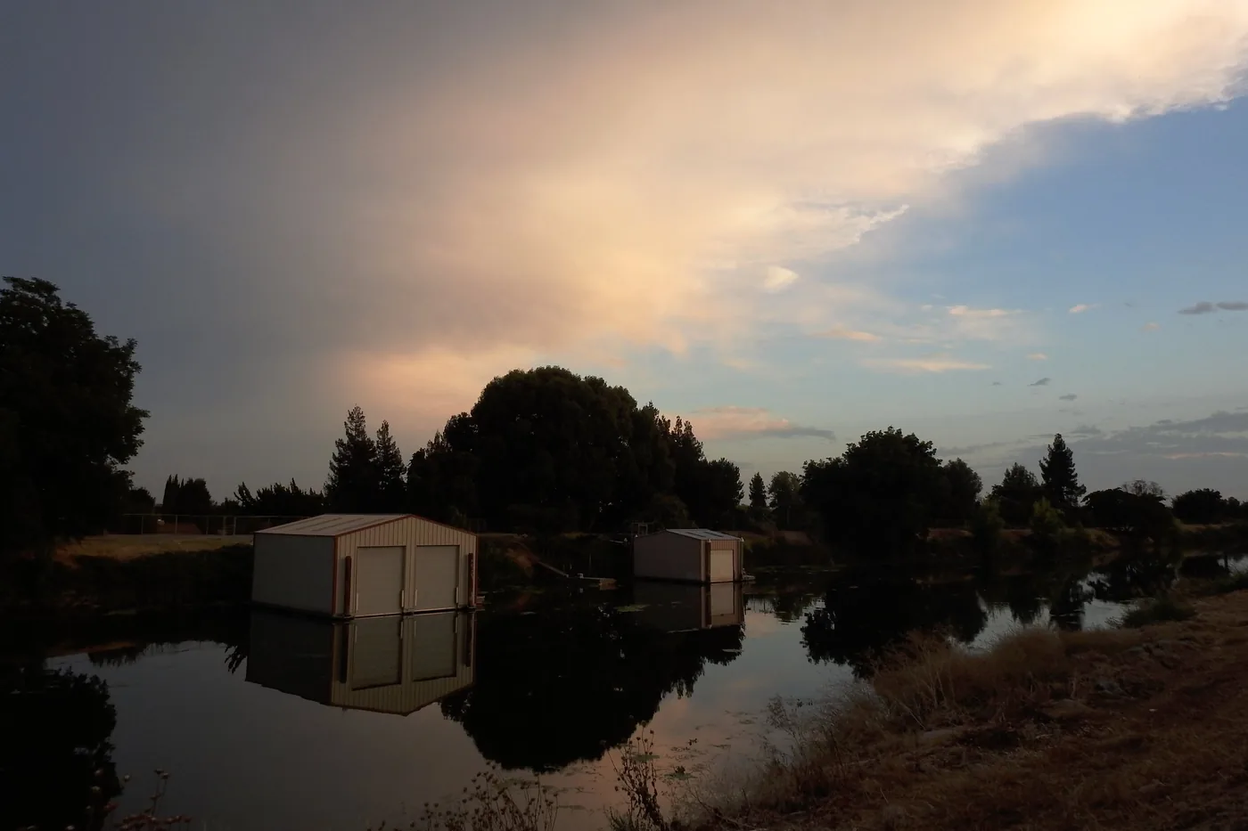 Storm clouds gathering over the Calaveras River in Stockton, California