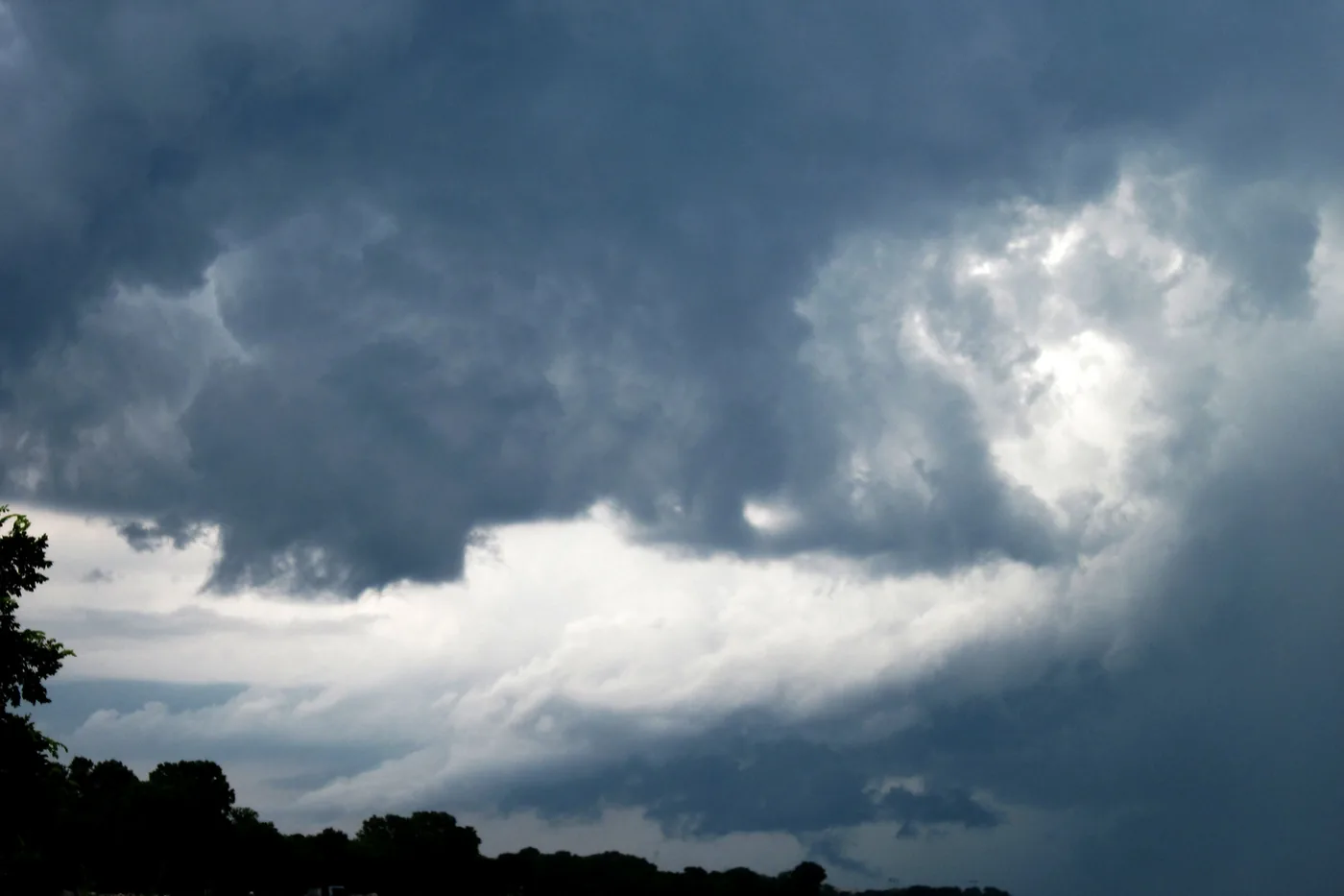 Swirling storm clouds over the treetops in Evanston, Illinois