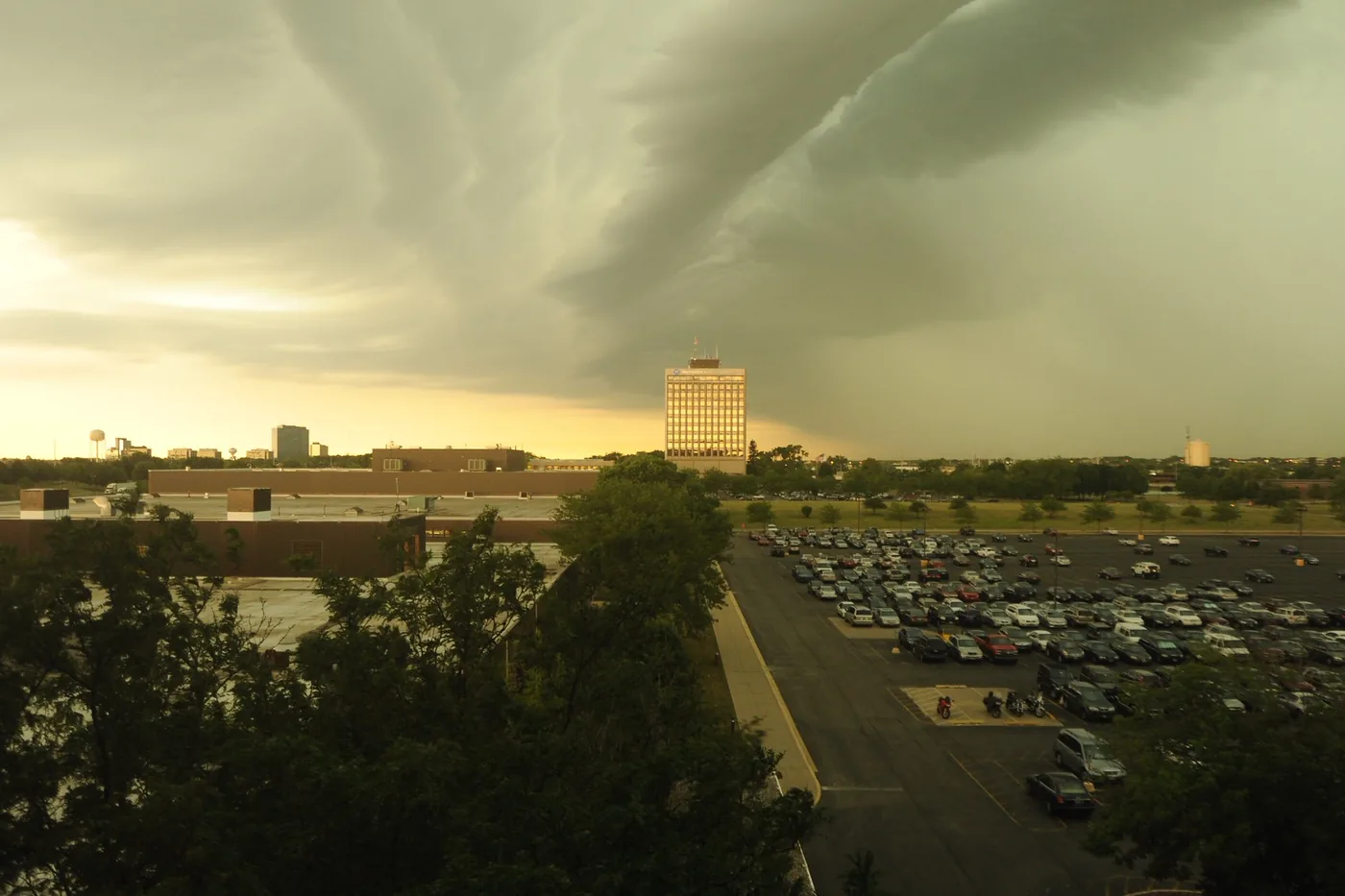 Dark storm front moving in over a corporate campus and parking lot in Schaumburg, Illinois