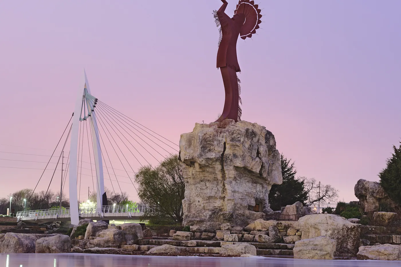 Clouds over the Keeper of the Plains sculpture and footbridge in Wichita, Kansas, before dawn