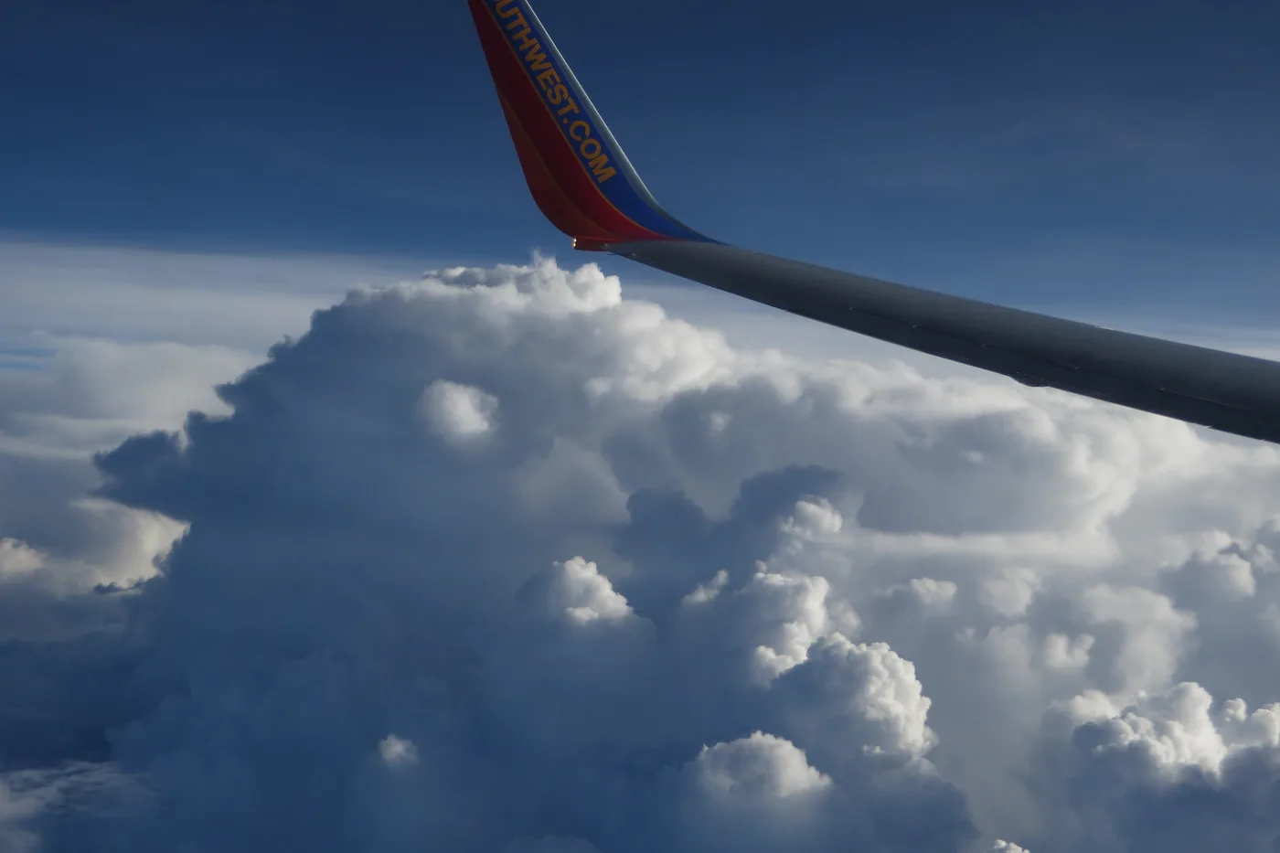 Towering thunderstorm clouds just east of Louisville, Kentucky, seen from an airliner window