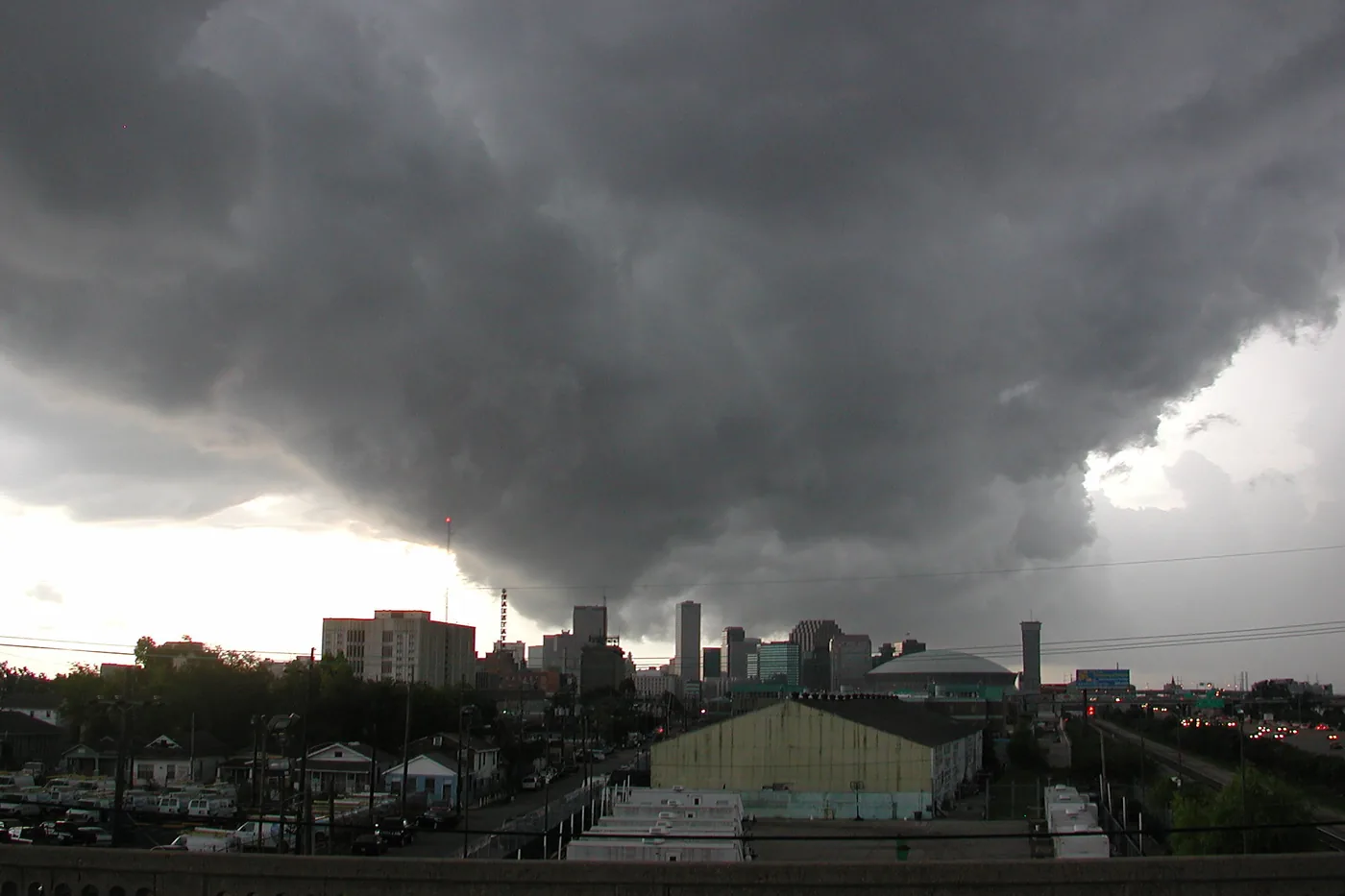 Towering storm cloud over buildings in New Orleans