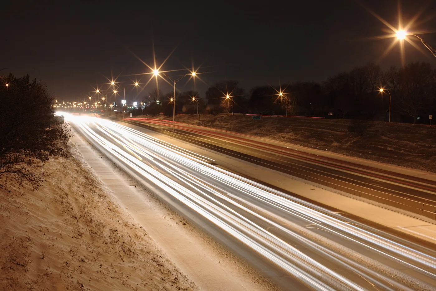 Traffic light trails on I-696 near Hoover Road in Warren, Michigan, at the start of a snowstorm