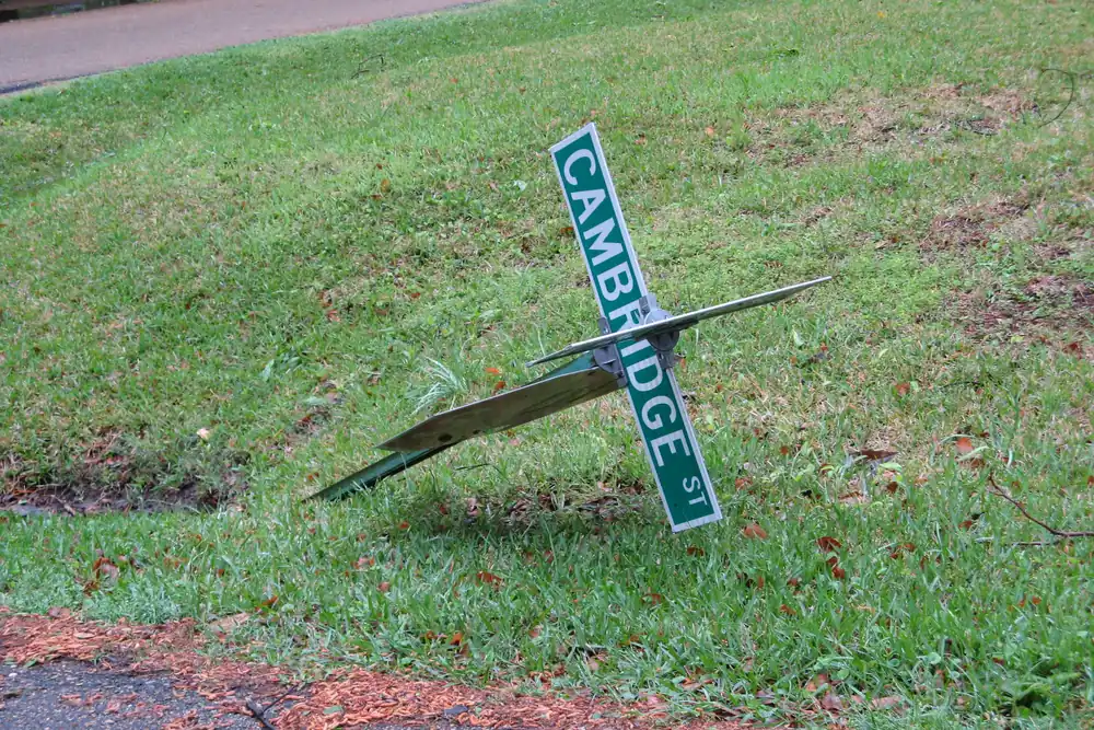 Street sign knocked flat onto the grass in Jackson, Mississippi, the day after a storm
