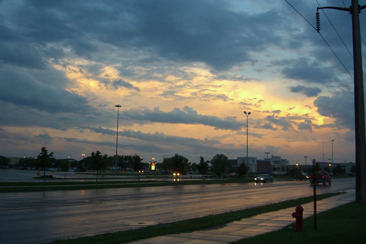 Stormy sky lit by the setting sun over a street in Fargo, North Dakota