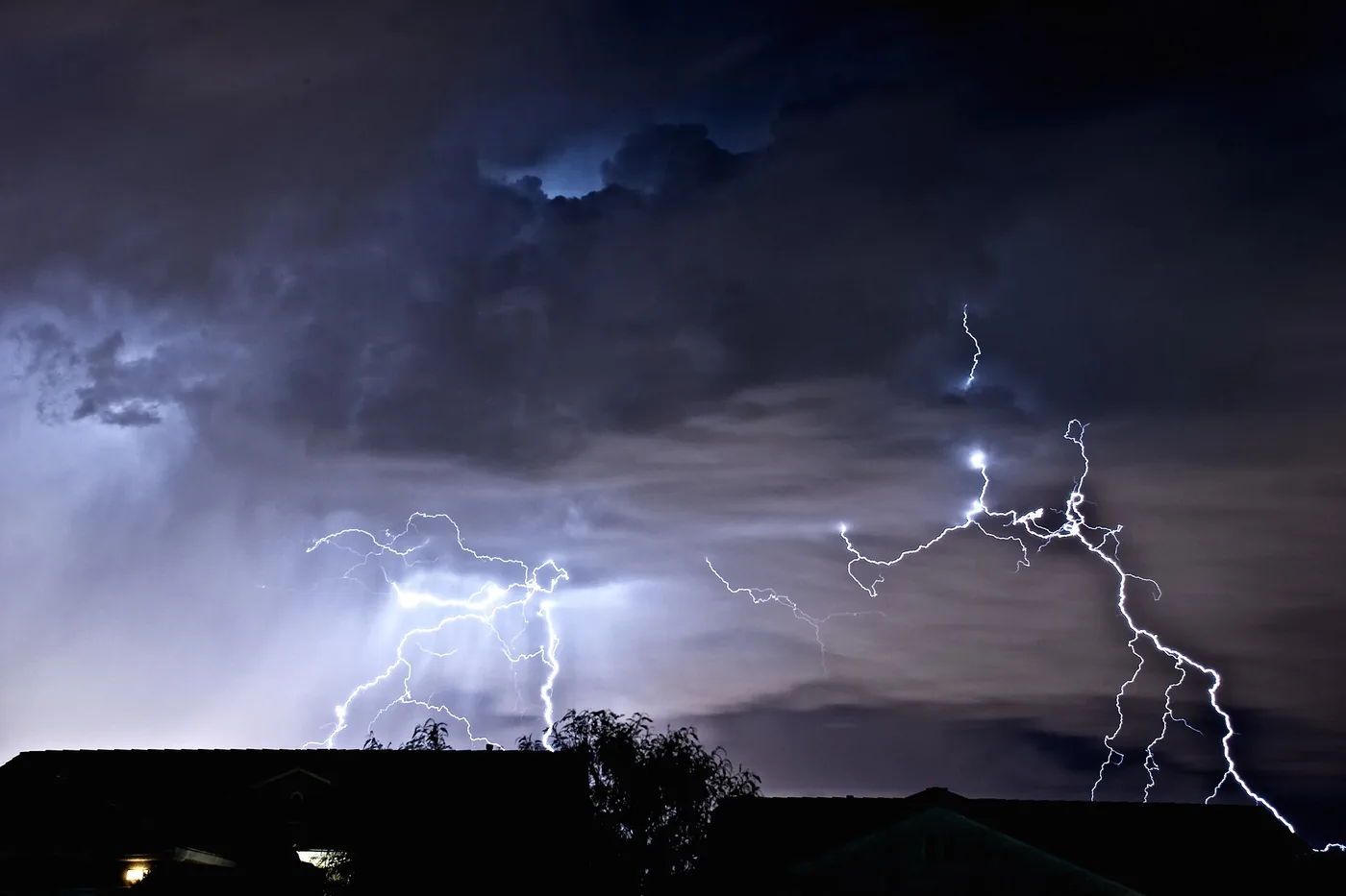 Lightning bolts striking from a night storm, seen from Henderson, Nevada, looking toward the Las Vegas Strip
