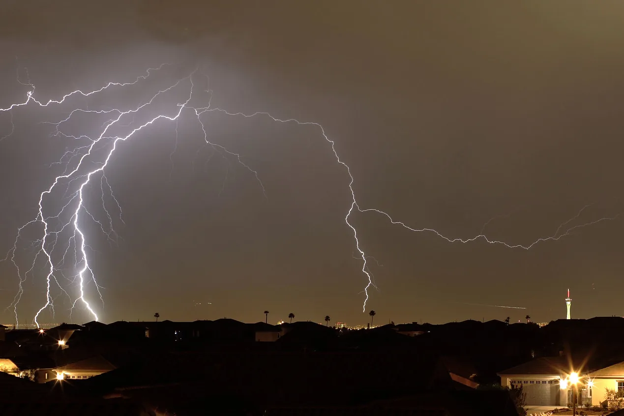 Lightning striking from a summer storm over the Las Vegas valley at night