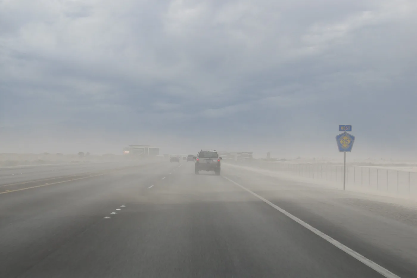 Blowing dust cutting visibility on a highway during a dust storm in North Las Vegas, Nevada