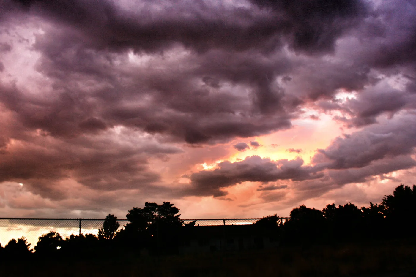 Dramatic storm clouds lit at sunset over Sparks, Nevada