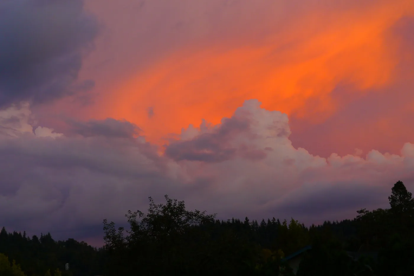 Brightly colored clouds over the hills at sunset in southwest Eugene, Oregon