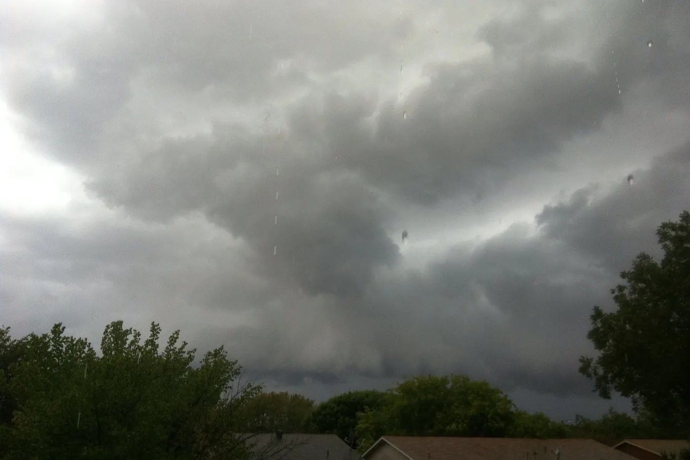 Heavy storm clouds and rain over trees in Abilene, Texas