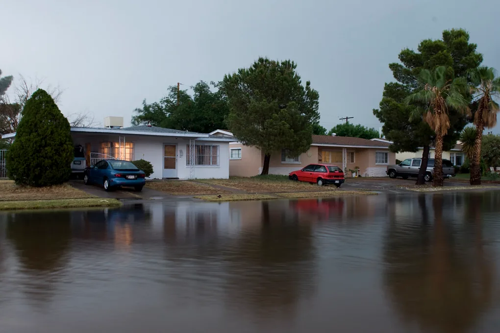 Street in El Paso's Cielo Vista neighborhood flooded after a heavy rainstorm