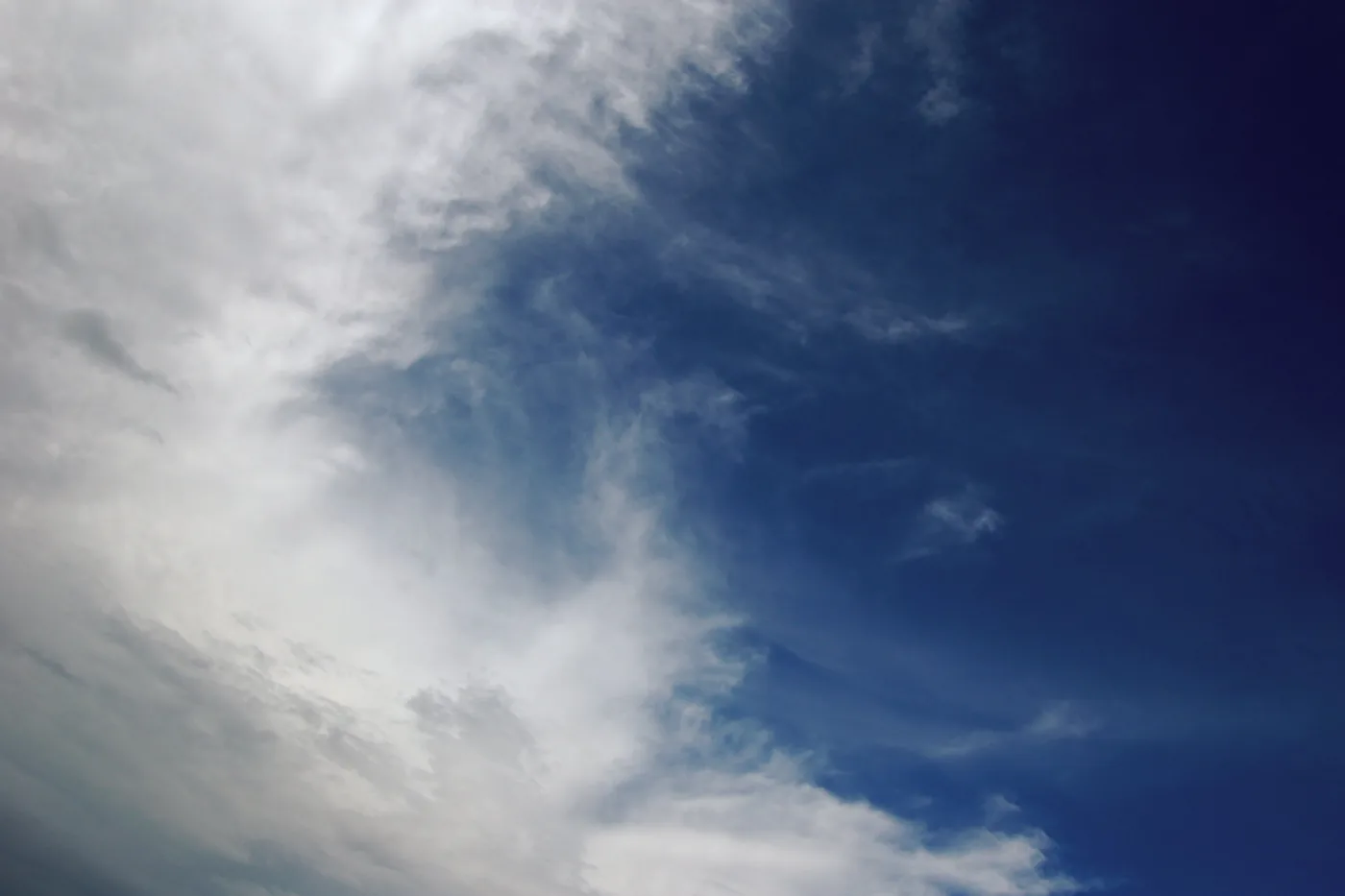 Billowing cloud edge sweeping across a deep blue sky over Round Rock, Texas