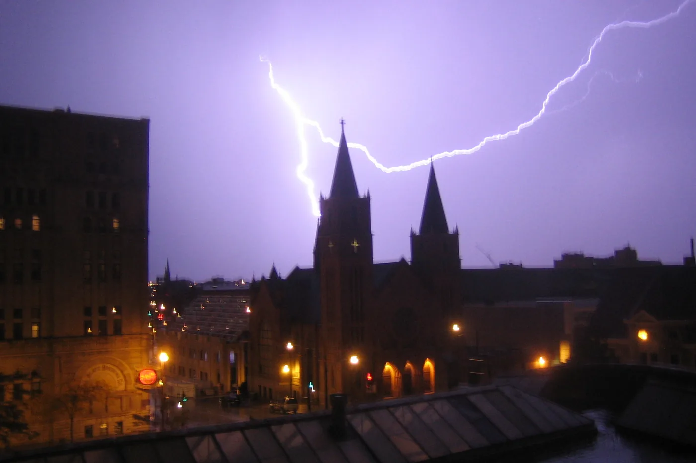Lightning forking over the twin spires of Grace Lutheran Church in Milwaukee at night