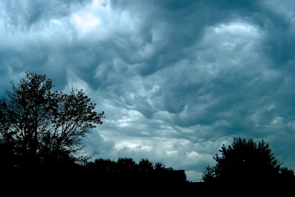 Dark, churning storm clouds over trees in Huntington, Indiana