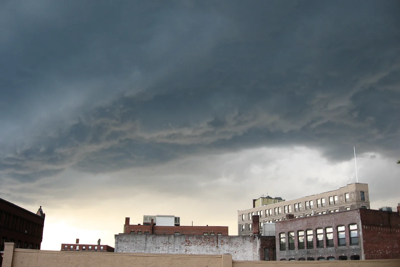 Storm clouds gathering over brick buildings at Lynn Station in Lynn, Massachusetts