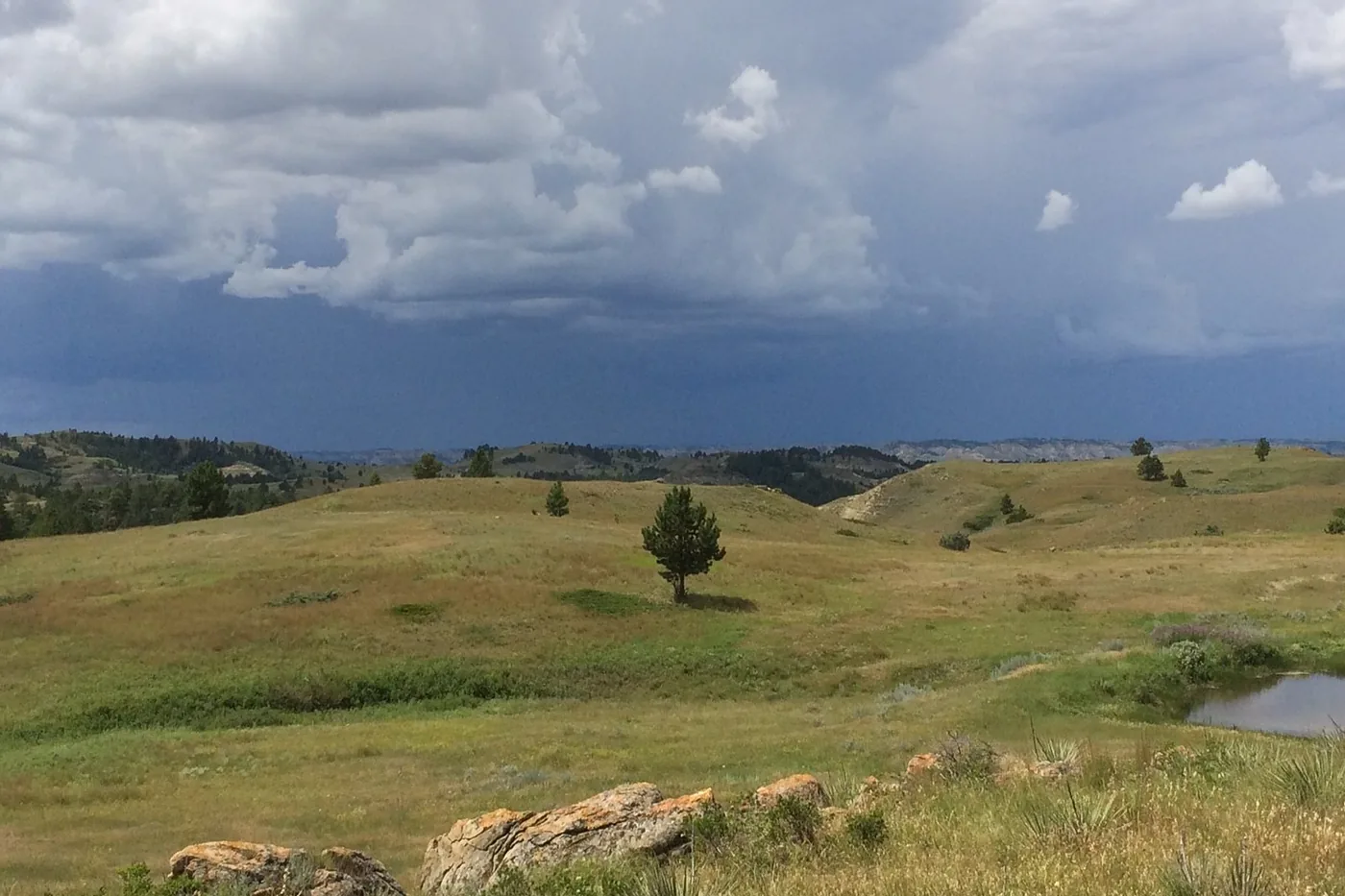 Thunderstorm moving over grassy hills of the Missouri River Breaks in Charles M. Russell National Wildlife Refuge, Montana